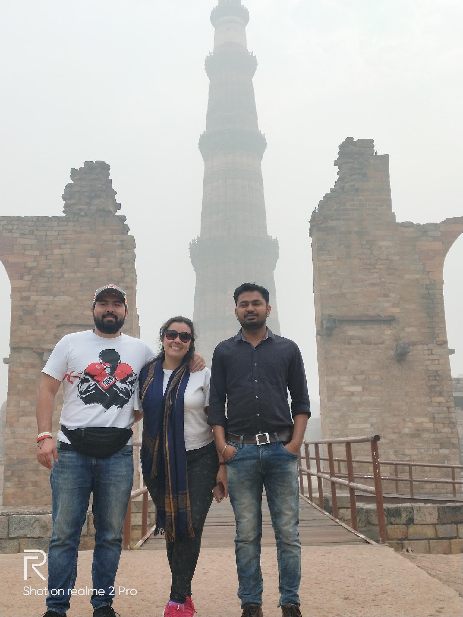 Traveler with Qutub Minar Delhi photo
